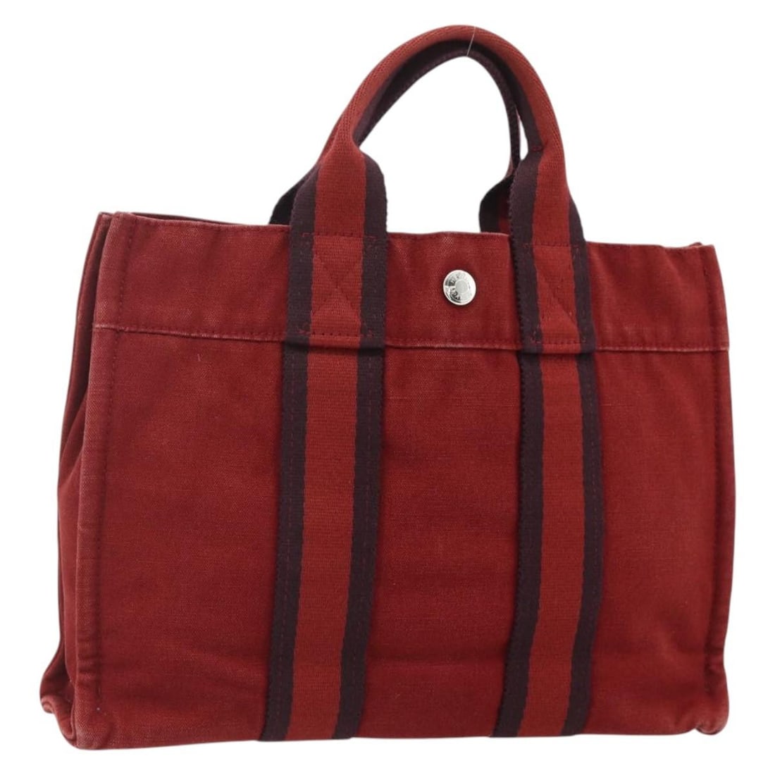 Hermes Fourre Tout PM red navy canvas handbag: Hermes Fourre Tout PM red navy canvas handbag This Hermes Fourre Tout PM handbag is crafted from durable canvas in a striking red and navy color combination. Designed for women, it features a compact 