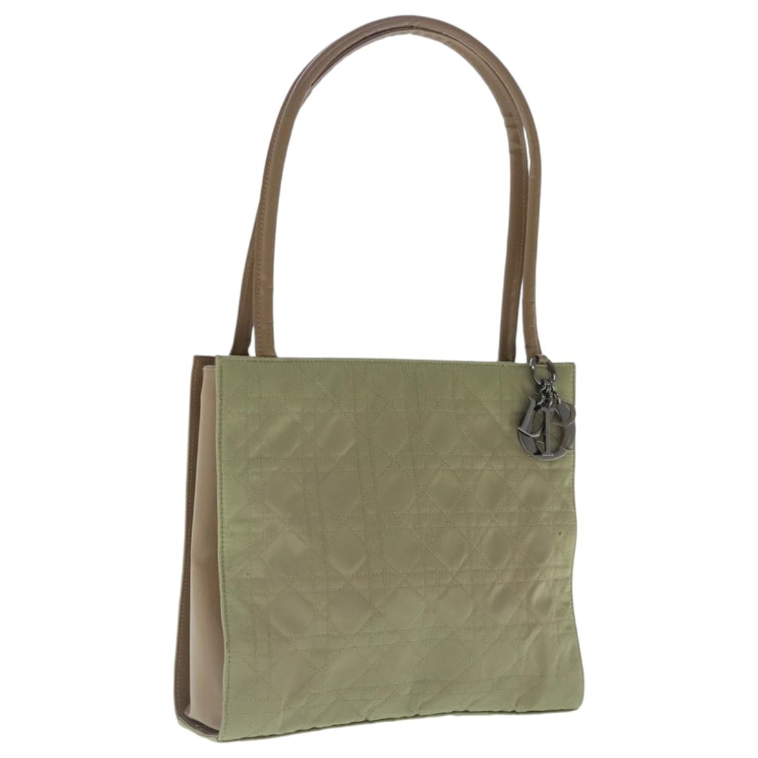 Christian Dior beige nylon shoulder bag with charm: Christian Dior beige nylon shoulder bag with charm This Christian Dior Canage shoulder bag is crafted from beige nylon and features a classic, structured silhouette. Designed for women, the bag is mad