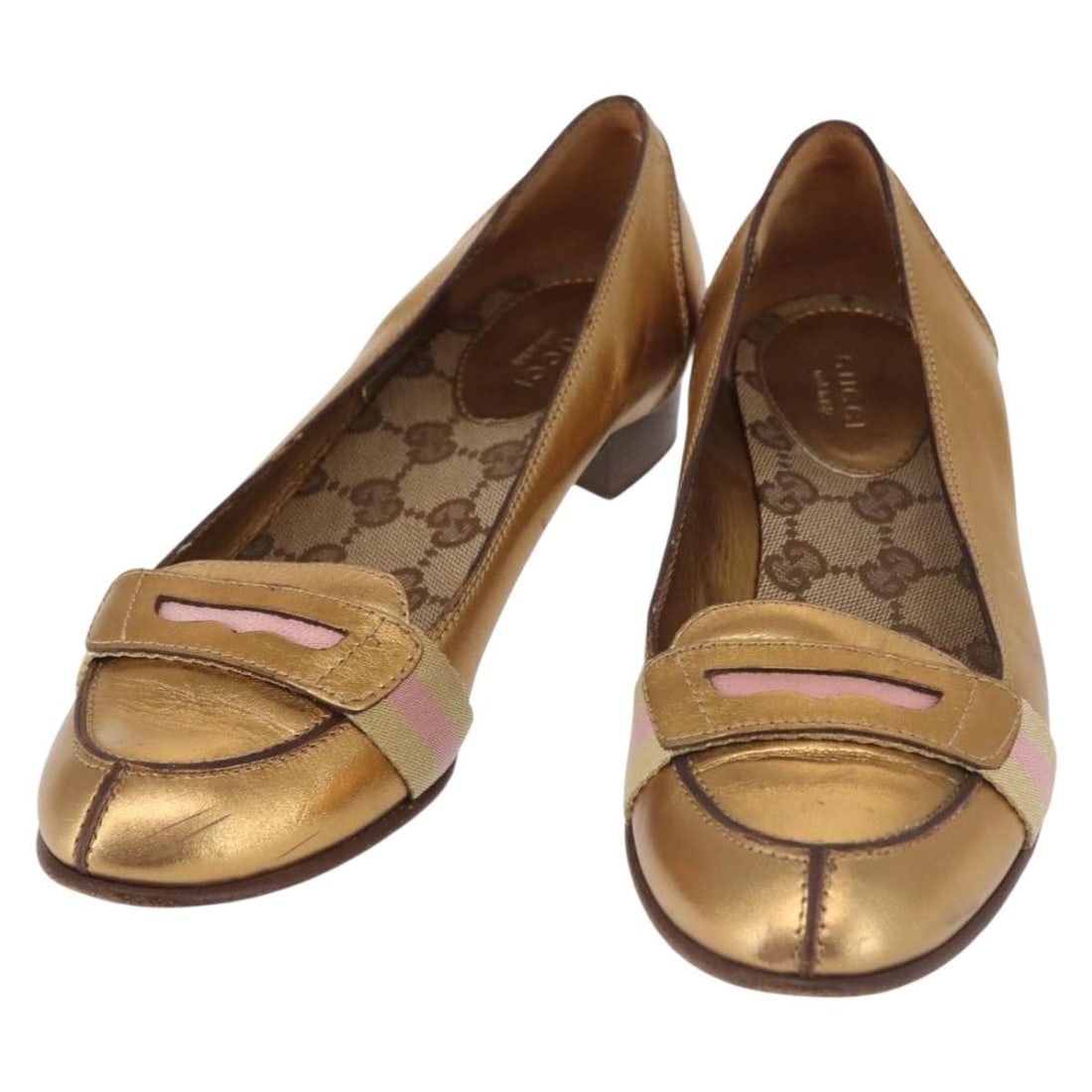 GUCCI Gold Leather High Heel Pumps Made in Italy: GUCCI Gold Leather High Heel Pumps Made in Italy Elevate your style with these authentic GUCCI high heel pumps, crafted in Italy from luxurious gold leather. Designed for elegance and sophistication, 