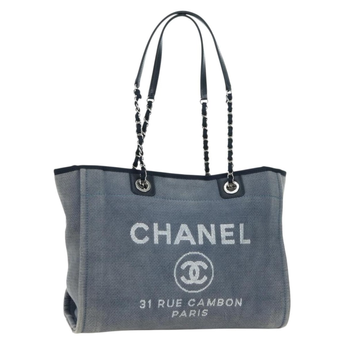 CHANEL Deauville Canvas Tote Blue Silver Chain Bag: CHANEL Deauville Canvas Tote Blue Silver Chain Bag This CHANEL Deauville line tote bag is crafted from blue and silver canvas and features chain handles. Made in Italy, the bag offers a spacious inter