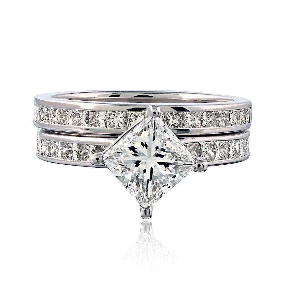 Platinum Engagement Ring with 1.52ct Princess Diamond and 37 Accent Stones: Platinum Engagement Ring with 1.52ct Princess Diamond and 37 Accent Stones This pre-owned platinum engagement ring features a 1.52 carat princess cut diamond with E color and VVS2 clarity, certified b