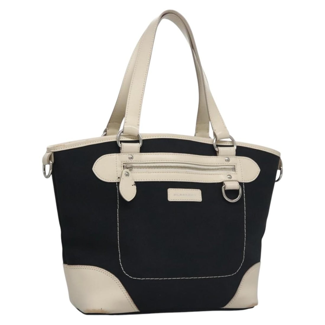 Navy Canvas Tote by Burberry for Women: Navy Canvas Tote by Burberry for Women This Burberry tote bag features a navy canvas exterior, designed for women. Made in Italy, the bag has a spacious interior and classic tote silhouette. The condi