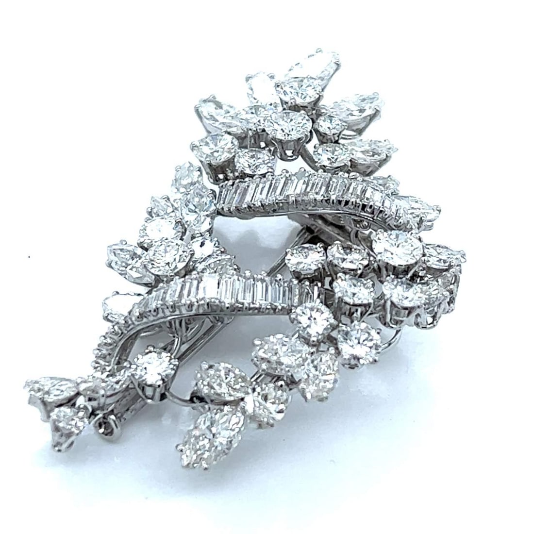Platinum Diamond Brooch 12.90 Ct F-G VVS-VS 1.75 inches: Platinum Diamond Brooch 12.90 Ct F-G VVS-VS 1.75 inches This exquisite platinum brooch features a stunning total diamond weight of 12.90 Ct, showcasing 45 diamonds weighing approximately 11.00 Ct and 