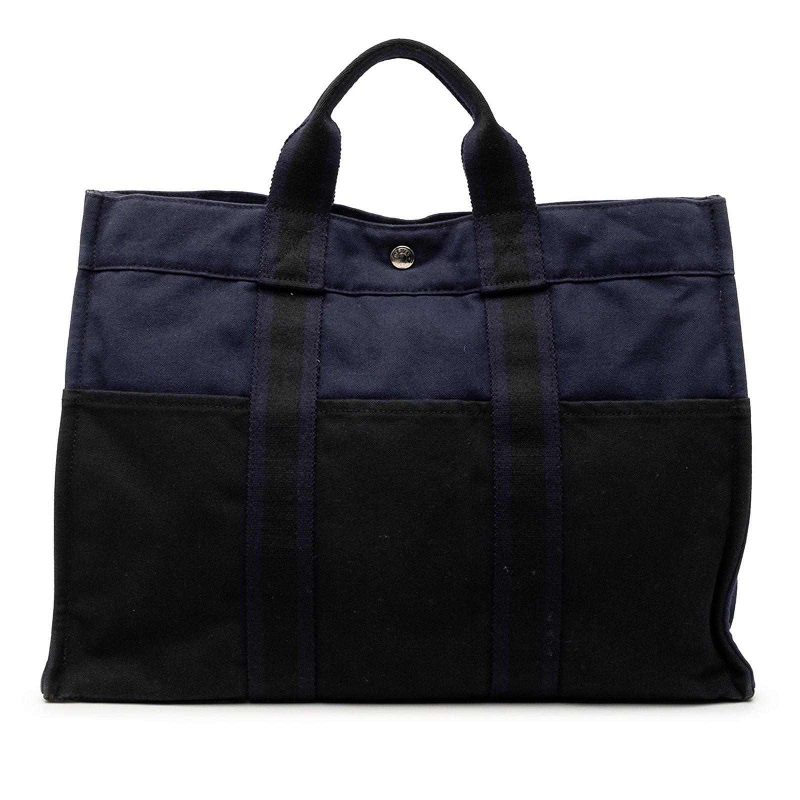 Hermes Fourre Tout MM Black Canvas Tote with Exterior Pockets: Hermes Fourre Tout MM Black Canvas Tote with Exterior Pockets The Hermes Bicolor Canvas Fourre Tout MM is a tote bag crafted from canvas in a bicolor design. It features front and back exterior slip p