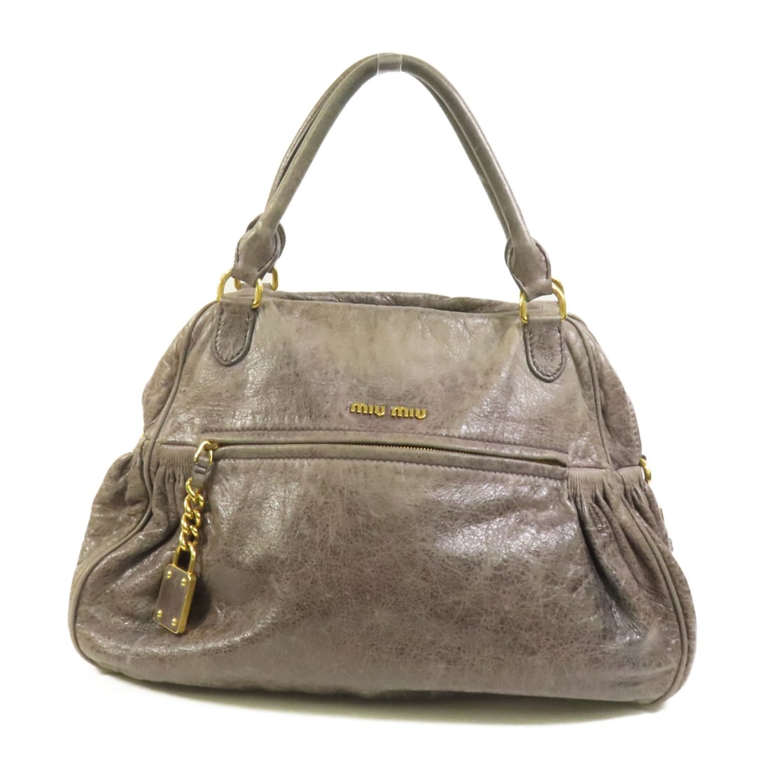 Gray Calfskin Leather Handbag from Miu Miu with Gold Hardware: Gray Calfskin Leather Handbag from Miu Miu with Gold Hardware This Miu Miu handbag is crafted from gray calfskin leather and features a regular size with a structured silhouette. Designed for everyday