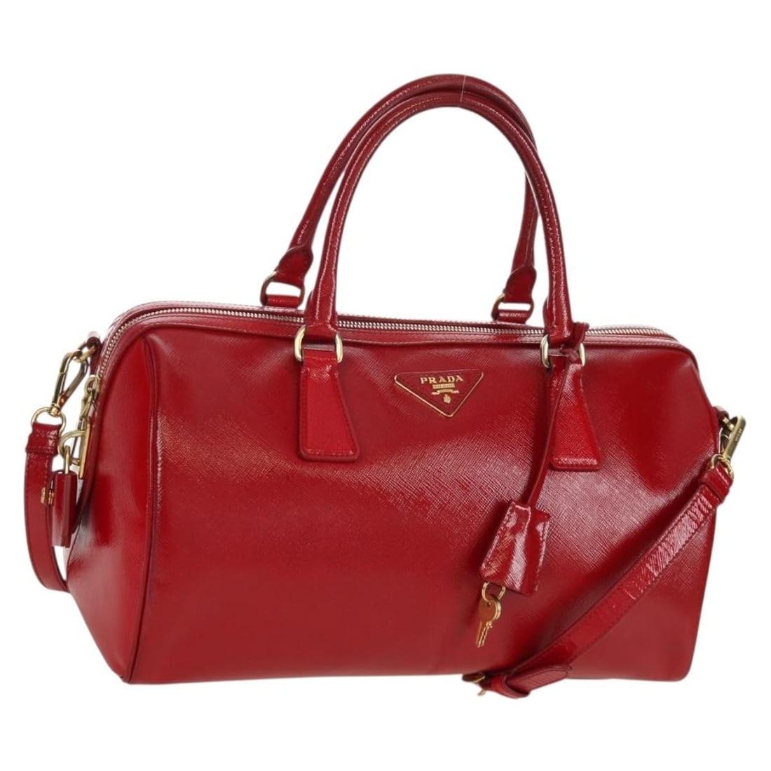 Prada Saffiano Leather Red Gold Two Way Handbag with Strap and Accessories: Prada Saffiano Leather Red Gold Two Way Handbag with Strap and Accessories This PRADA 2-way handbag is crafted from red Saffiano leather and features gold-tone accents. Designed for women, it can be c