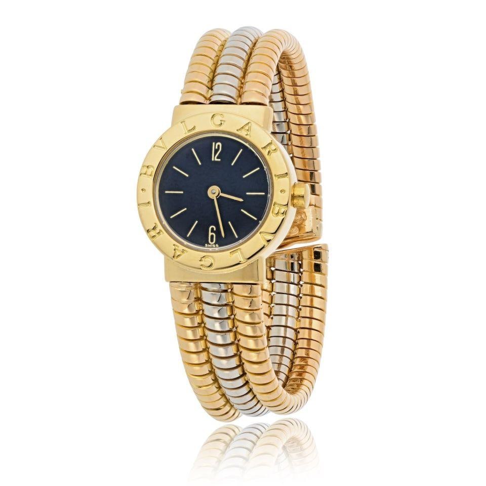 Bvlgari Tubogas BB 232T 18K Two Tone Vintage Watch: Bvlgari Tubogas BB 232T 18K Two Tone Vintage Watch Experience the elegance of Italian craftsmanship with the Bvlgari Tubogas BB 232T watch. This exquisite vintage timepiece features a striking black r