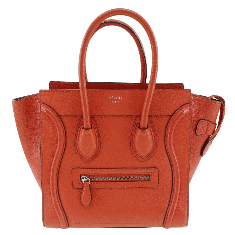Red Calfskin Celine Luggage Handbag 26cm Italian Made: Red Calfskin Celine Luggage Handbag 26cm Italian Made The Celine Luggage Bag is crafted from red grainy calfskin leather designed for female use. This Italian-made handbag features a compact size with