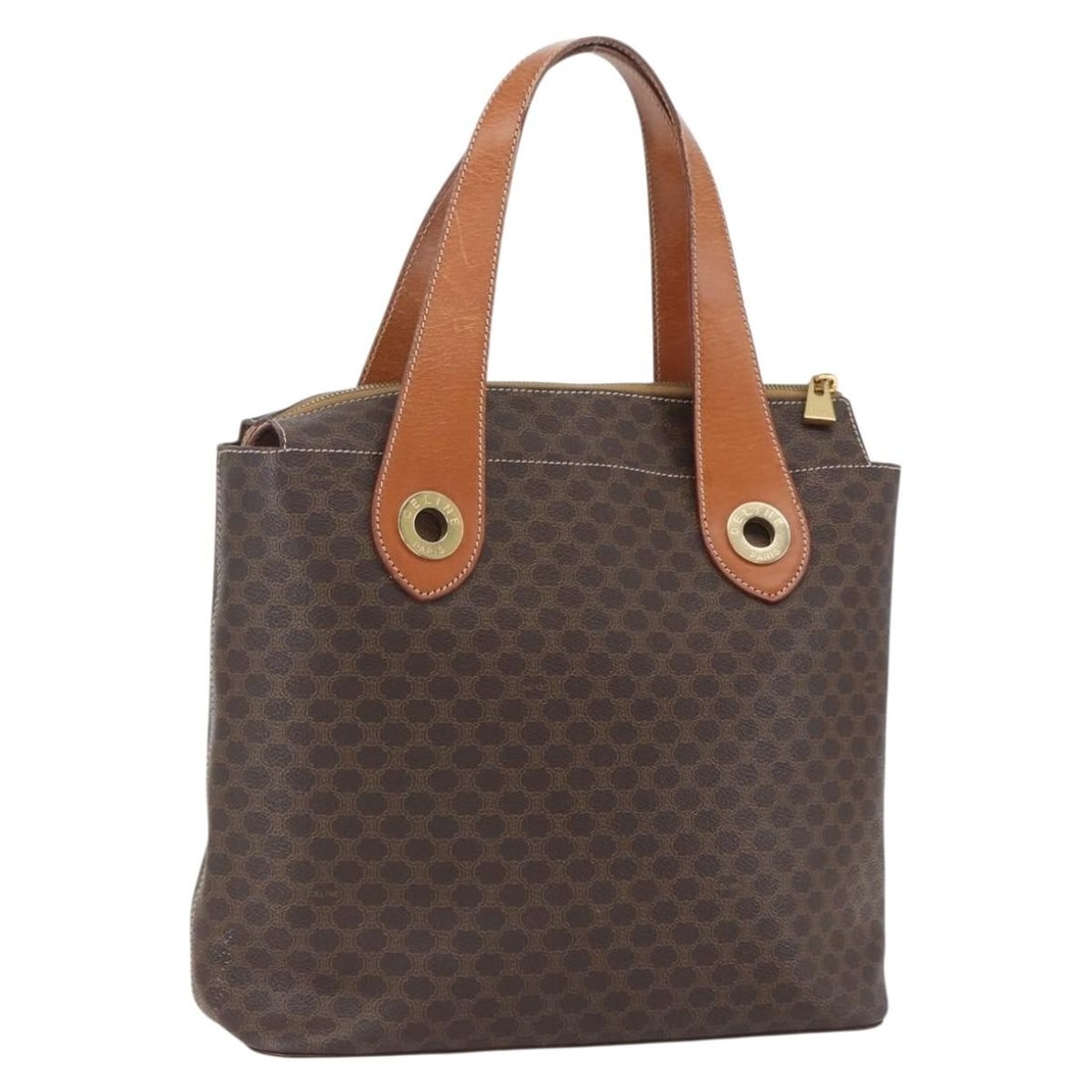 Celine Macadam Canvas Brown Gold PVC Leather Handbag Made in Italy: Celine Macadam Canvas Brown Gold PVC Leather Handbag Made in Italy This CELINE Macadam Canvas handbag features a PVC leather and canvas exterior in brown and gold tones. The bag is crafted in Italy an