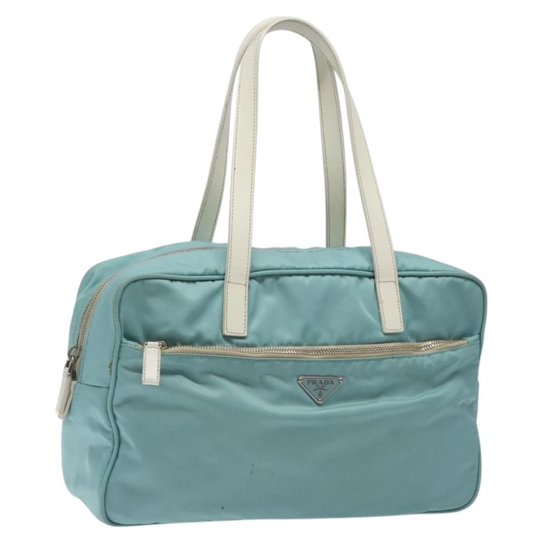 Prada Nylon Blue Silver Handbag with Guarantee Card Italy: Prada Nylon Blue Silver Handbag with Guarantee Card Italy This Prada hand bag features a blue and silver nylon exterior with silver-tone hardware. Designed for women, it offers a spacious main compart