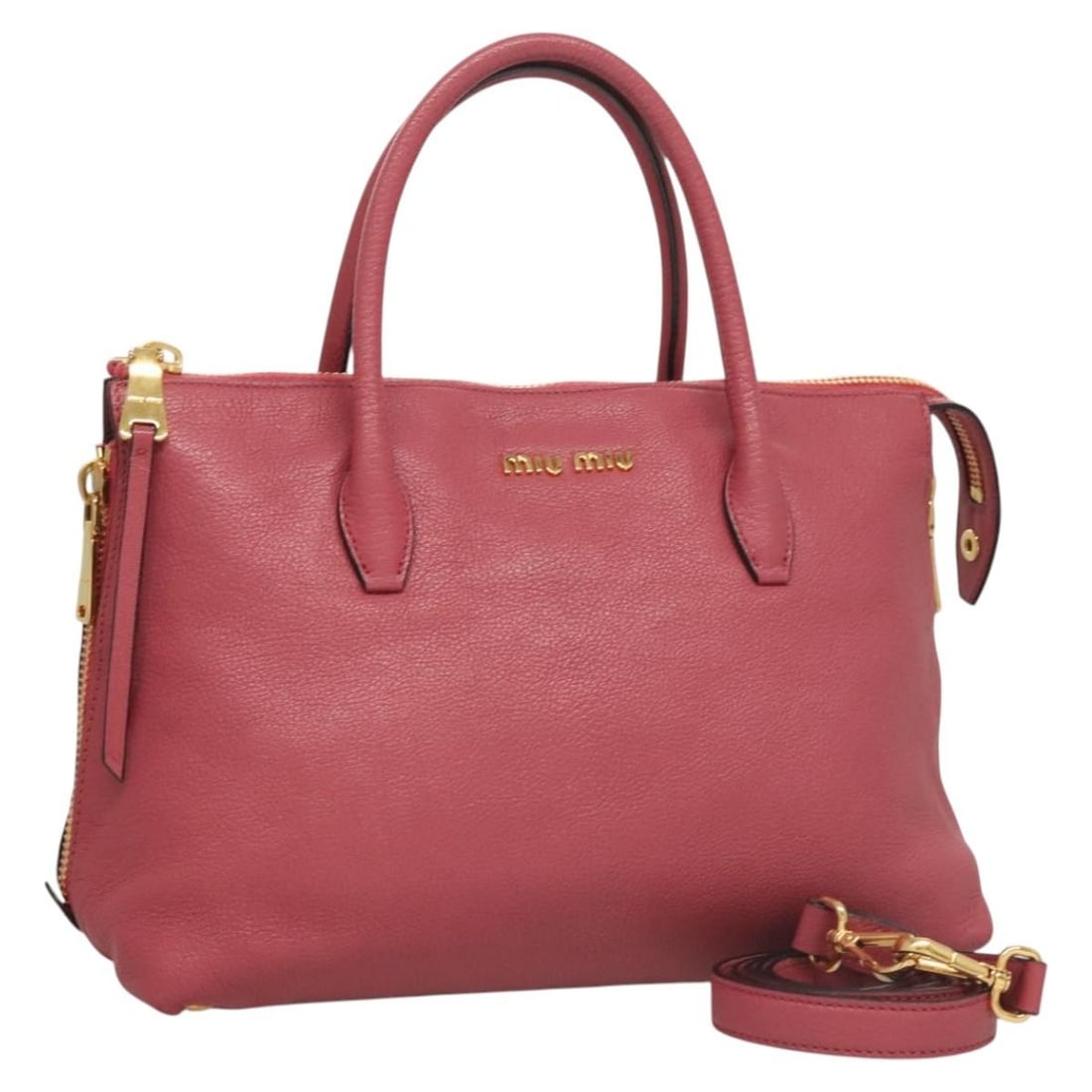 Miu Miu Grainy Leather Convertible Madras Satchel Pink Side Zip: Miu Miu Grainy Leather Convertible Madras Satchel Pink Side Zip This pre-owned Miu Miu Convertible Madras Side Zip Satchel is crafted from grainy pink leather and designed for female use. It features 
