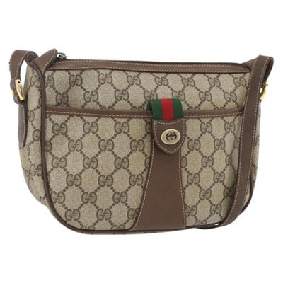 Gucci Sherry Line GG Supreme Beige Gold Shoulder Bag: Gucci Sherry Line GG Supreme Beige Gold Shoulder Bag This GUCCI GG Supreme Web Sherry Line shoulder bag features a beige and gold color scheme with PVC leather and GG canvas materials. Designed with a