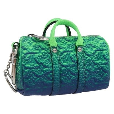 Louis Vuitton Mini Keepall Charm Green Monogram Canvas MP3284: Louis Vuitton Mini Keepall Charm Green Monogram Canvas MP3284 This Louis Vuitton Taurillon Illusion Porte Cles Mini Keepall charm features a striking green Monogram Canvas construction. Designed as a 