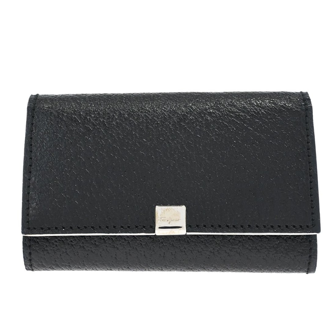 Black Leather Key Case by Salvatore Ferragamo with Button Logo Accent: Black Leather Key Case by Salvatore Ferragamo with Button Logo Accent This Salvatore Ferragamo key case features a classic black leather design with a button logo accent. Crafted in Italy, it is a vin