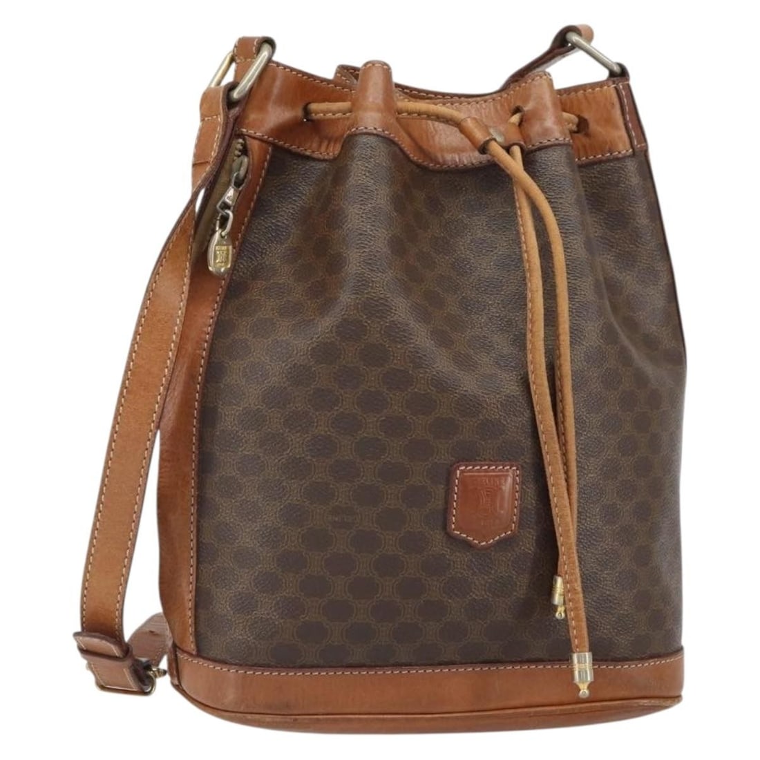 CELINE Macadam PVC Leather Brown Gold Shoulder Bag Italy: CELINE Macadam PVC Leather Brown Gold Shoulder Bag Italy This CELINE shoulder bag features the iconic Macadam canvas with PVC leather accents in brown and gold tones. Made in Italy, the bag offers a s