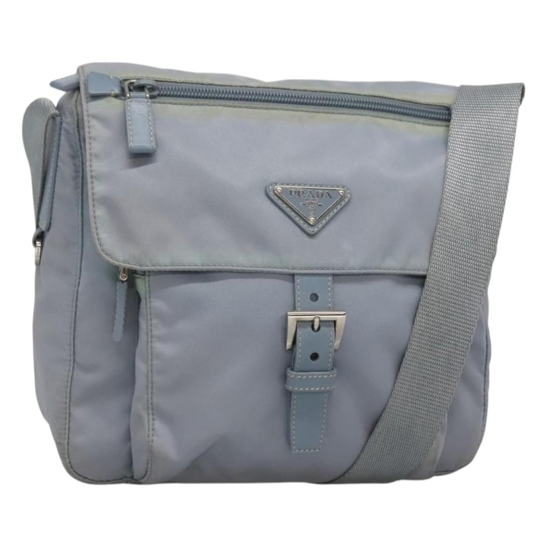 Prada nylon light blue silver shoulder bag with guarantee card: Prada nylon light blue silver shoulder bag with guarantee card This PRADA shoulder bag is crafted from light blue nylon with silver-tone accents. Designed for women, it features a practical shoulder s