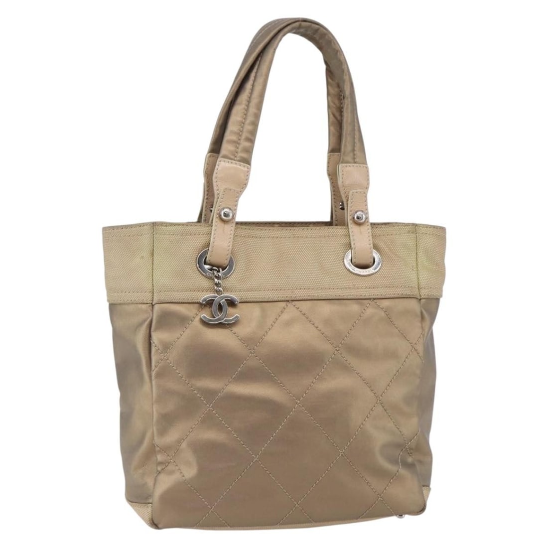 CHANEL Biarritz PM Tote Bag Gold Coated Canvas Auth: CHANEL Biarritz PM Tote Bag Gold Coated Canvas Auth Introducing the CHANEL Paris Biarritz PM Tote Bag, a luxurious accessory crafted from durable coated canvas in a stunning gold finish. This tote bag