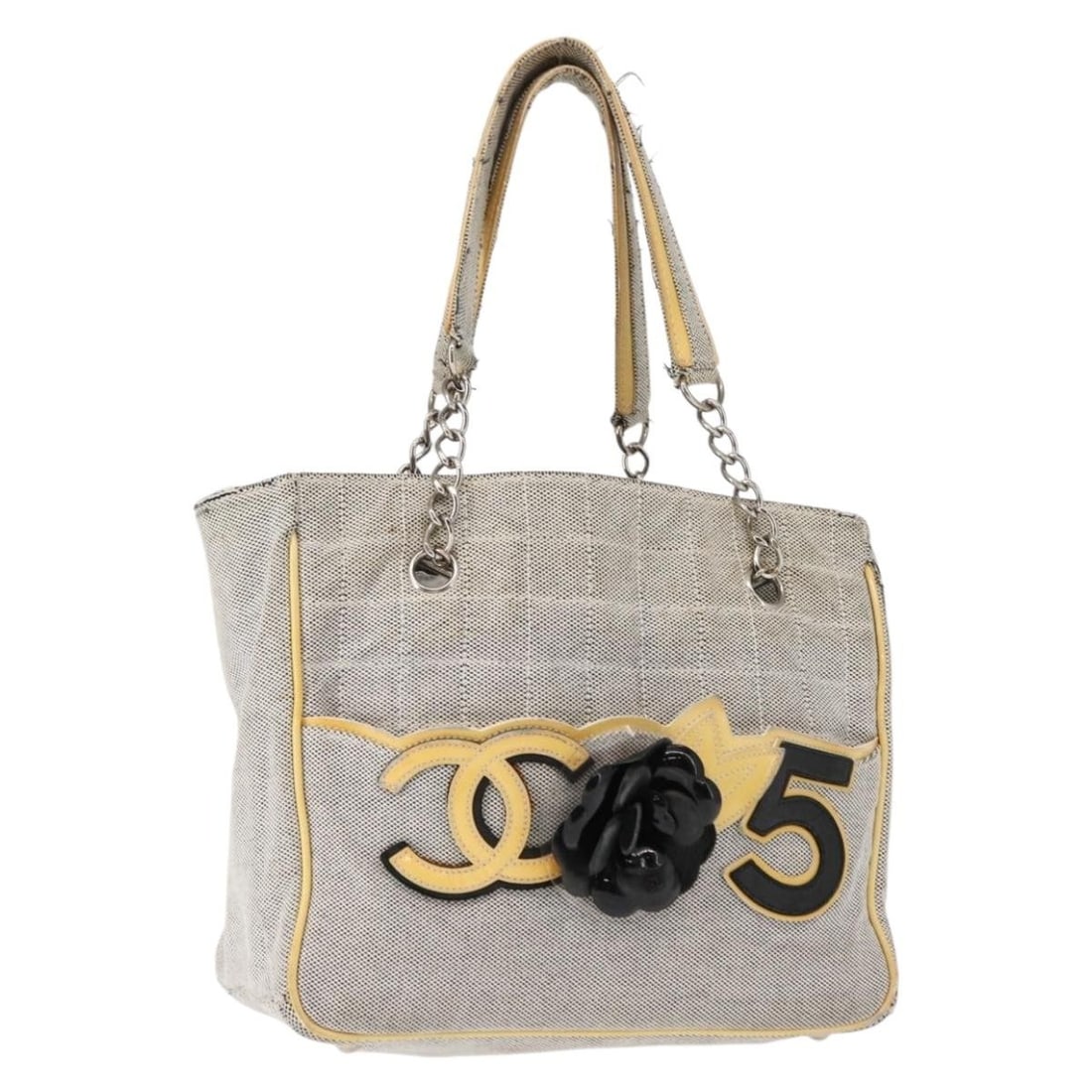 CHANEL Choco Bar Camellia Gray Silver Canvas Tote Bag Authentic: CHANEL Choco Bar Camellia Gray Silver Canvas Tote Bag Authentic Introducing the CHANEL Choco Bar Camellia Chain Tote Bag, a stylish and versatile accessory crafted from durable gray and silver canvas.