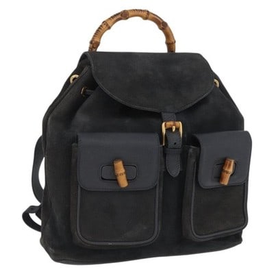 Gucci Bamboo black suede leather backpack 003 2058 0016: Gucci Bamboo black suede leather backpack 003 2058 0016 This GUCCI Bamboo Backpack is crafted from black suede leather with gold-tone accents. The backpack features a classic bamboo handle, a structur