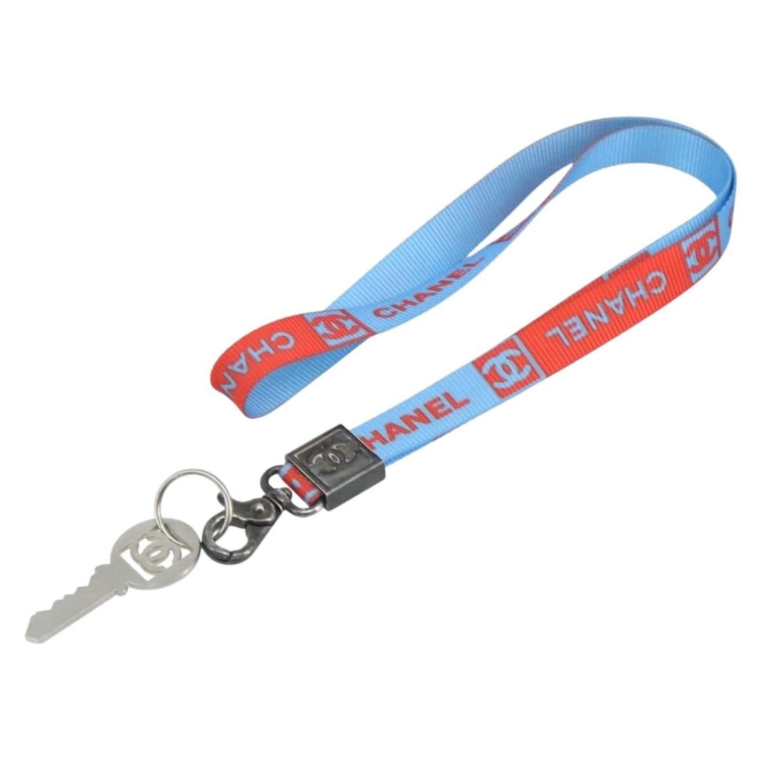 Red and Blue Canvas CHANEL Sports CC Necklace Strap: Red and Blue Canvas CHANEL Sports CC Necklace Strap This CHANEL sports necklace strap is crafted from canvas in a striking red and blue color combination. Designed as a strap accessory, it features a 