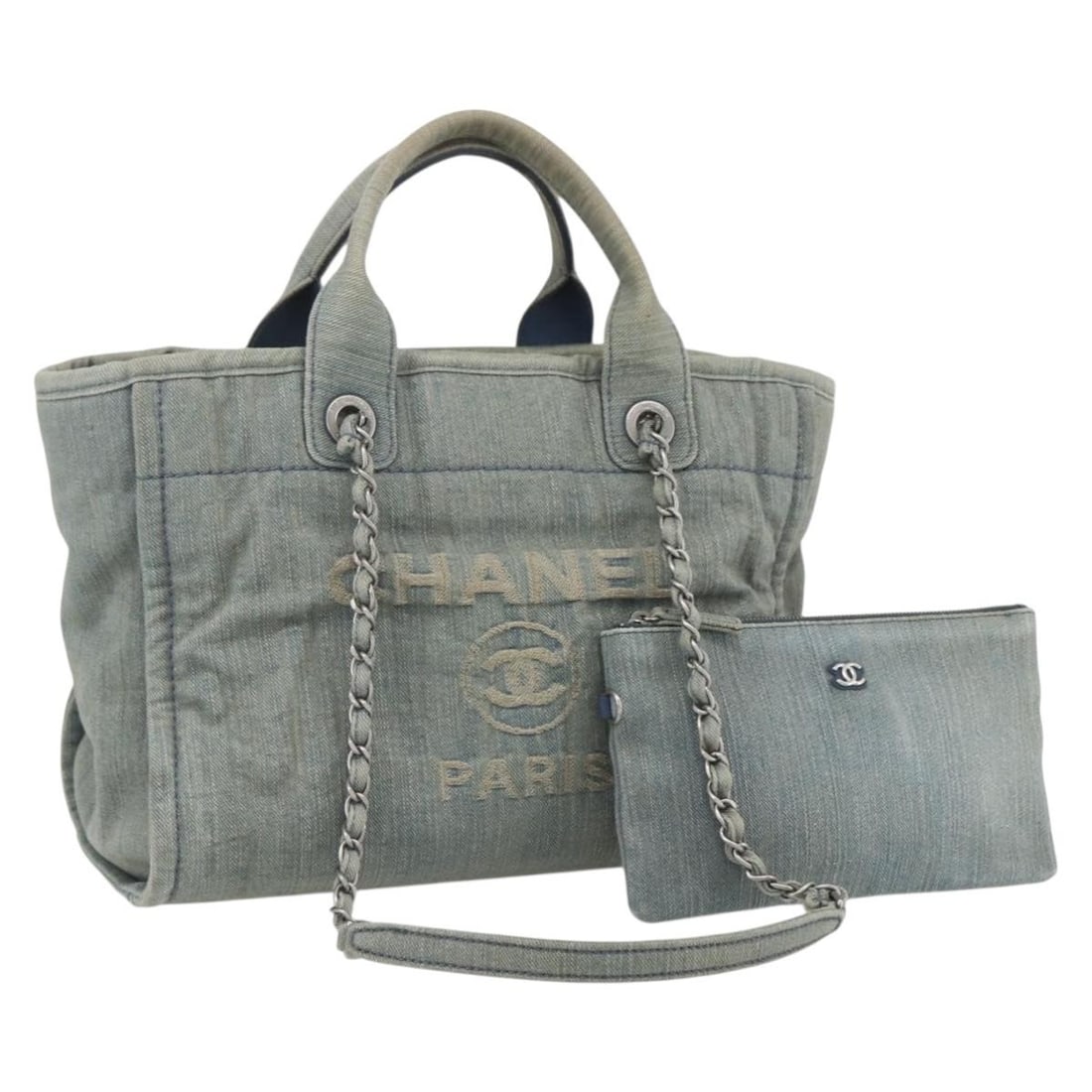 CHANEL Denim Blue Chain Deauville Tote Bag Authentic Italy: CHANEL Denim Blue Chain Deauville Tote Bag Authentic Italy This CHANEL Chain Deauville Tote Bag in Denim Blue is a stylish and practical accessory crafted from durable canvas. Designed in Italy, this 
