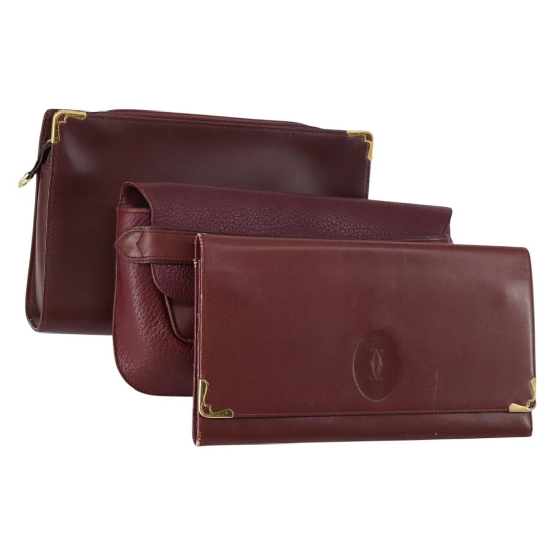 CARTIER Bordeaux Leather Clutch Bag 3 Piece Set Authentic: CARTIER Bordeaux Leather Clutch Bag 3 Piece Set Authentic Elevate your accessory collection with this authentic Cartier clutch bag set, featuring a stylish bordeaux leather exterior. This clutch is no