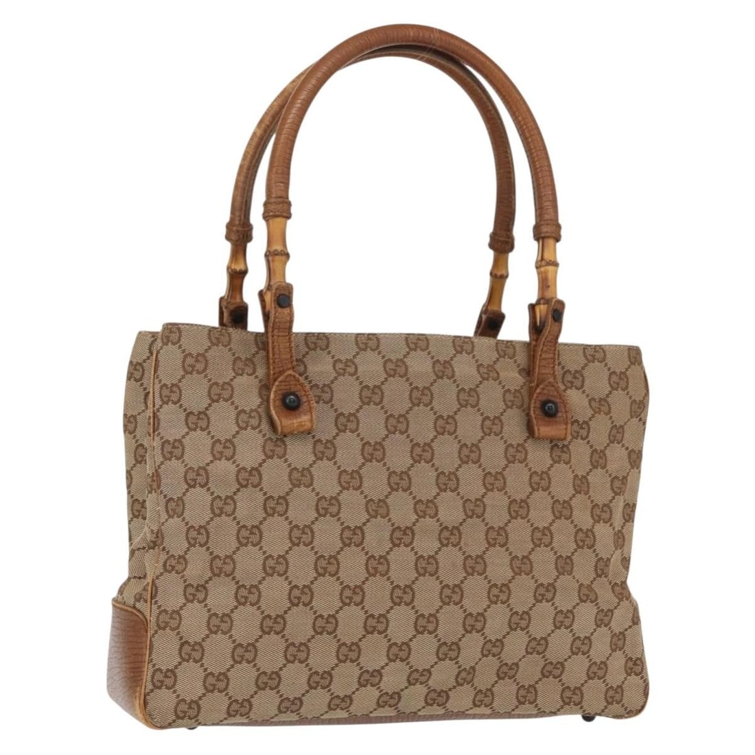 Beige GG Canvas Bamboo Handle Tote by Gucci 112526: Beige GG Canvas Bamboo Handle Tote by Gucci 112526 This is a Gucci GG Canvas Bamboo Tote Bag in beige. Crafted in Italy, it features the signature GG canvas material with bamboo handles. The tote has 