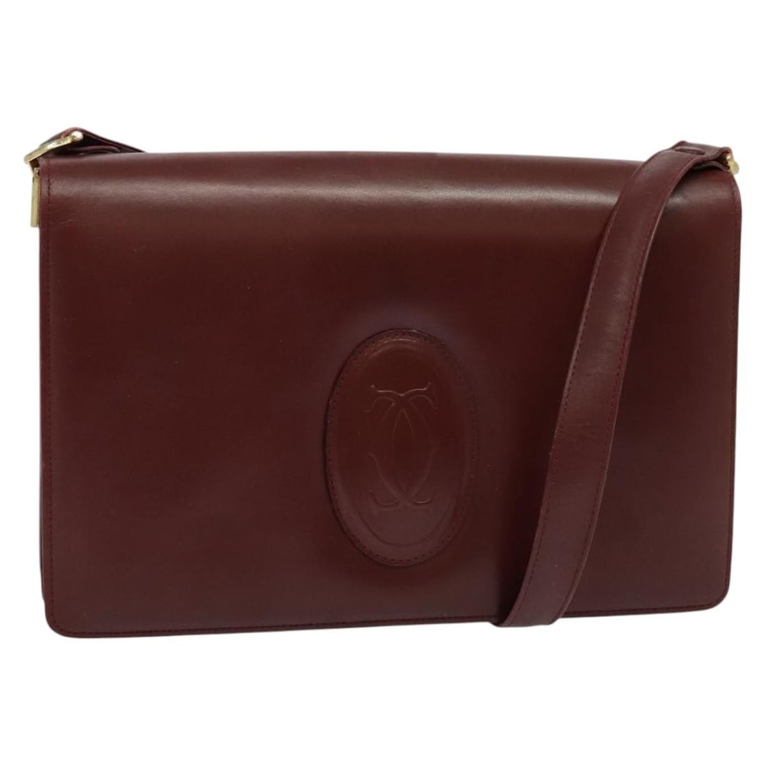 CARTIER Must Line Bordeaux Leather Shoulder Bag Gold Accents: CARTIER Must Line Bordeaux Leather Shoulder Bag Gold Accents Introducing the exquisite CARTIER Must Line Shoulder Bag, a perfect blend of elegance and functionality. Crafted from premium leather in a 
