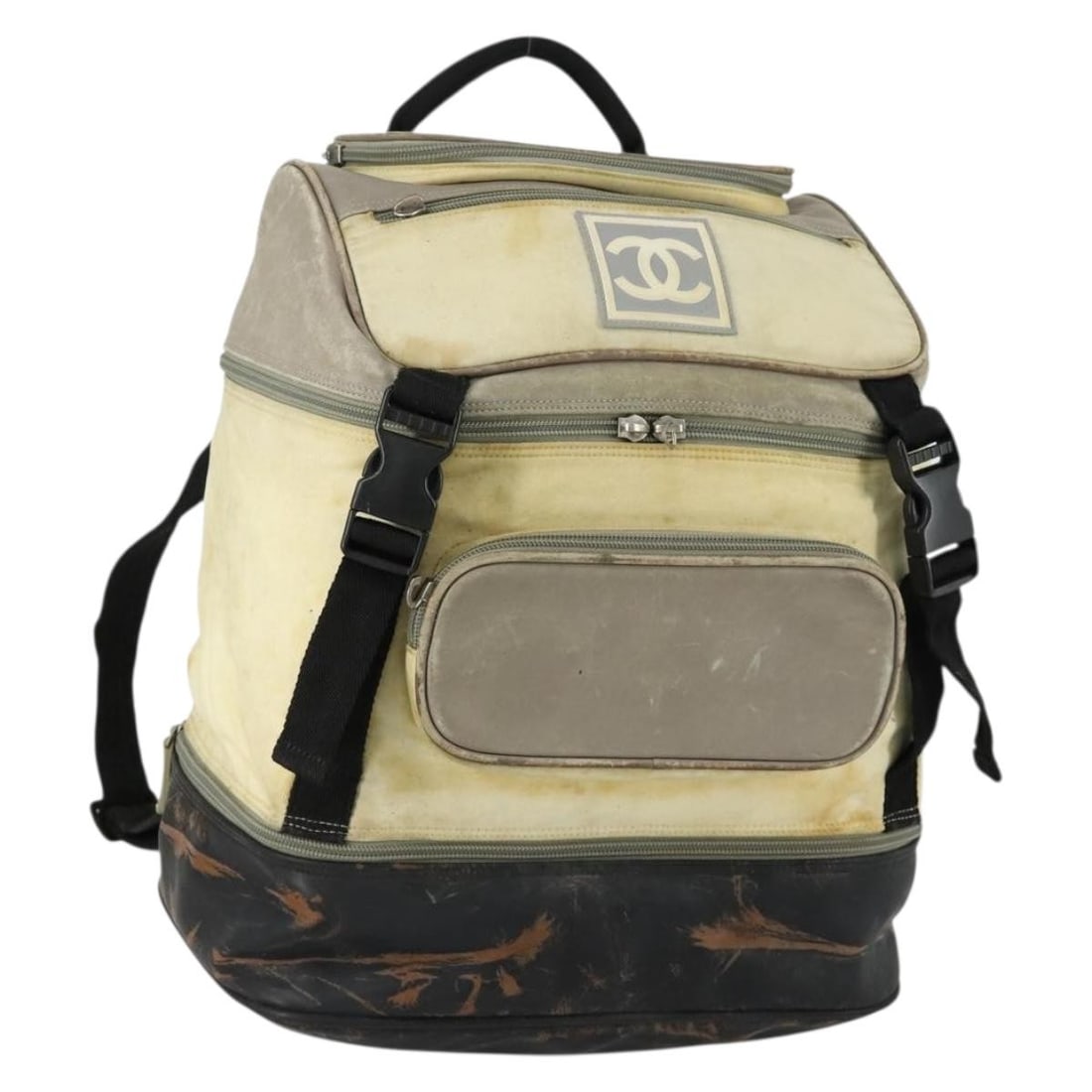 CHANEL beige silver nylon leather COCO Mark backpack: CHANEL beige silver nylon leather COCO Mark backpack This CHANEL Sports Line COCO Mark backpack is crafted from beige and silver nylon with leather accents. Designed for women, it features the signatu