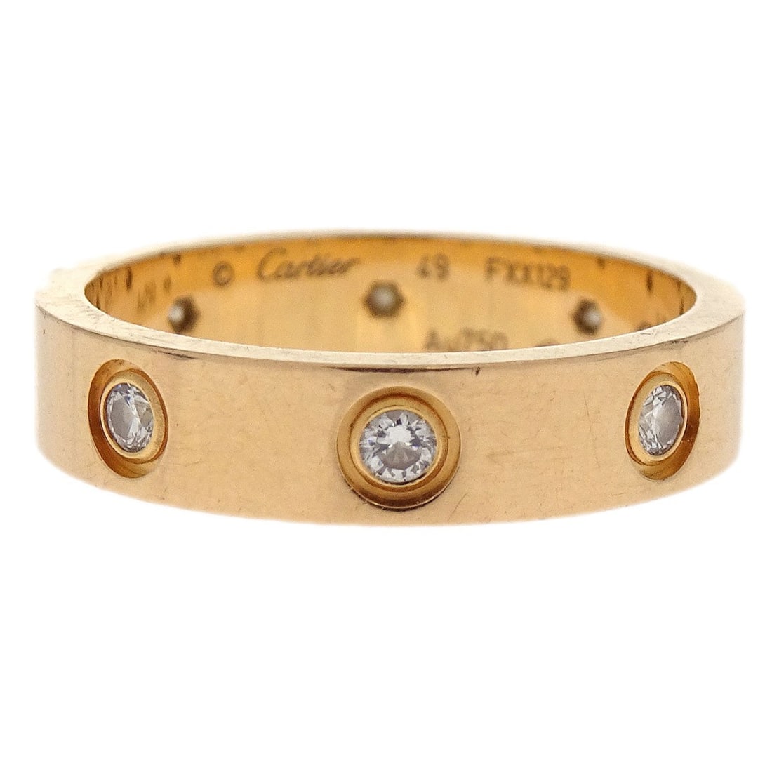Cartier Love Mini Rose Gold Diamond Ring Size 49 Au750: Cartier Love Mini Rose Gold Diamond Ring Size 49 Au750 This vintage Cartier Mini Love Ring is crafted from 18k rose gold (Au750) and features a diamond accent. The ring has a round shape and is a size