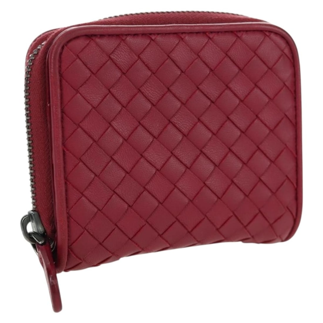 Bottega Veneta Pink Leather Intrecciato Compact Round Wallet Italy: Bottega Veneta Pink Leather Intrecciato Compact Round Wallet Italy This Bottega Veneta Intrecciato round compact wallet is crafted from pink leather and features the signature woven design. The wallet