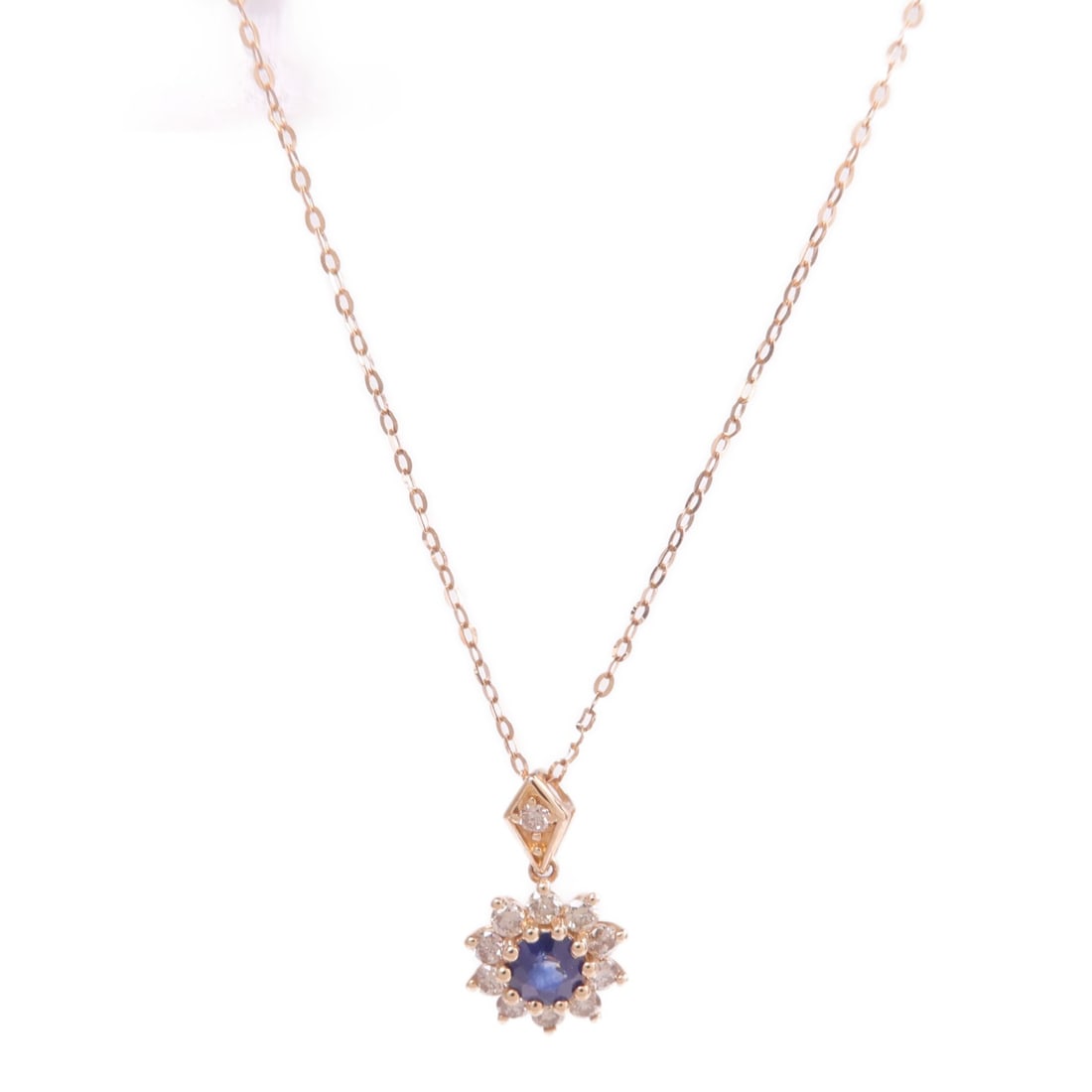 Sapphire and Diamond Pendant Necklace in 18K Rose Gold: Sapphire and Diamond Pendant Necklace in 18K Rose Gold This women's necklace features a striking blue sapphire as the main stone, set in 18K pink (rose) gold. The piece combines elegant design with hi