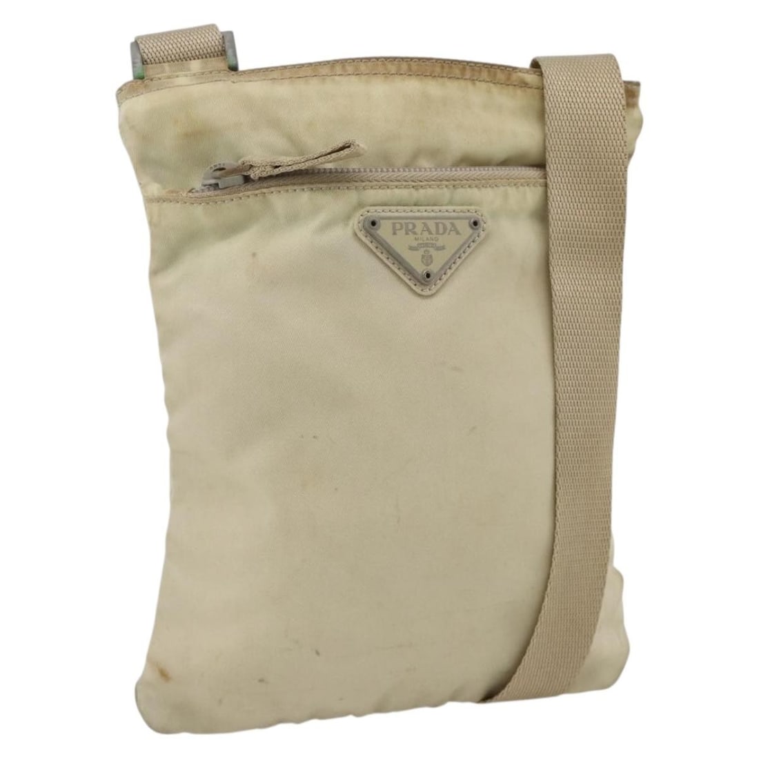 Prada Beige Nylon Women's Shoulder Bag with Silver Tone Details: Prada Beige Nylon Women's Shoulder Bag with Silver Tone Details This Prada shoulder bag is crafted from beige nylon with silver-tone accents. Designed for women, it features an adjustable shoulder str