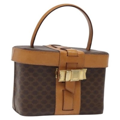 CELINE Macadam Canvas Brown Gold Vanity Handbag PVC Leather Italy: CELINE Macadam Canvas Brown Gold Vanity Handbag PVC Leather Italy This CELINE vanity bag features the iconic Macadam canvas with PVC leather accents in brown and gold tones. Designed in a compact and 
