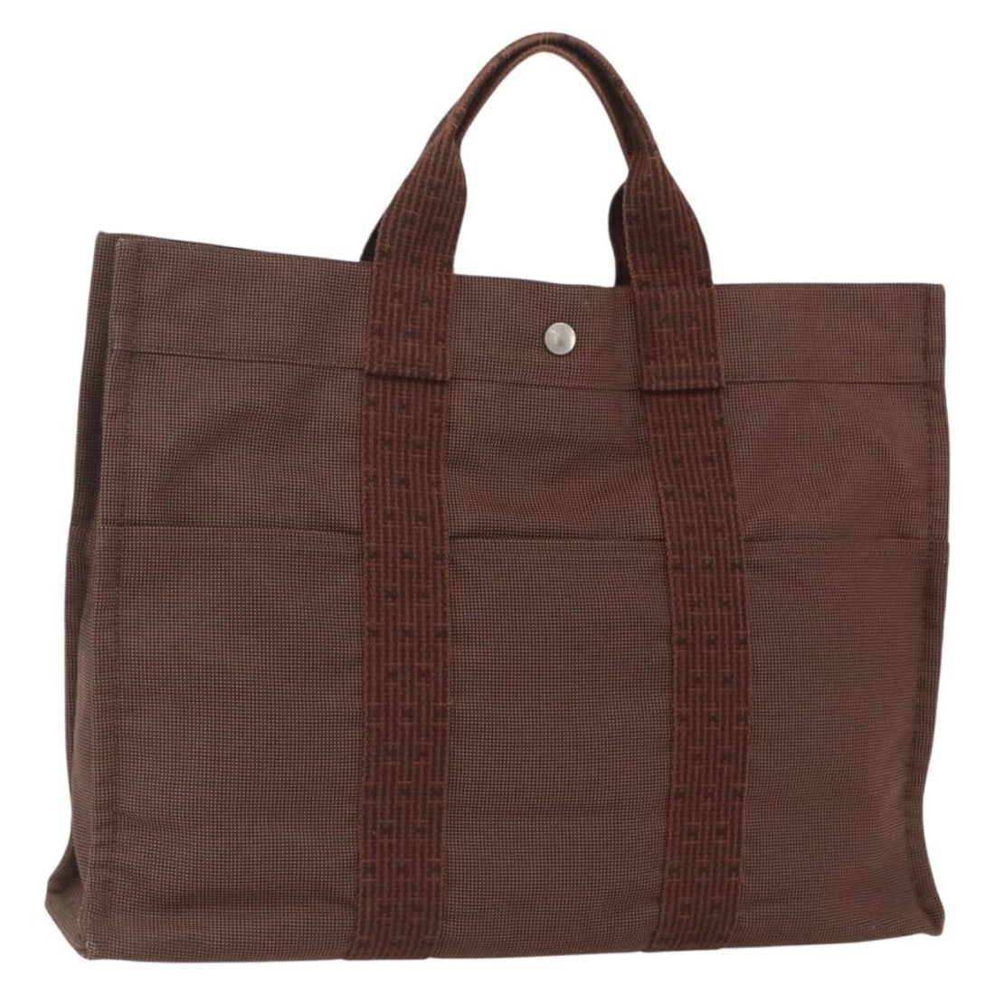 Brown Canvas Her Line MM Tote Bag by Hermes France: Brown Canvas Her Line MM Tote Bag by Hermes France This is an HERMES Her Line Tote MM tote bag crafted from brown canvas. The bag is made in France and features a spacious interior ideal for everyday 