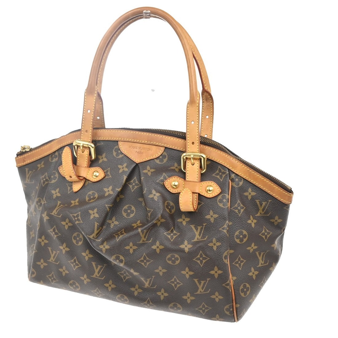 Tivoli Brown Canvas Handbag by Louis Vuitton France: Tivoli Brown Canvas Handbag by Louis Vuitton France The Louis Vuitton Tivoli Handbag features the iconic Monogram canvas in brown and is designed for women. This pre-owned bag is in good condition wit