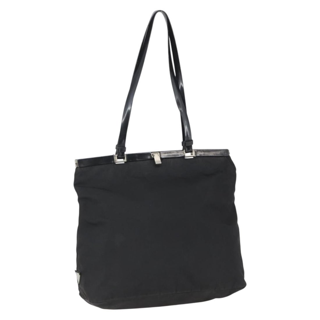 Black Nylon Tote with Silver Accents by PRADA Italy: Black Nylon Tote with Silver Accents by PRADA Italy This PRADA tote bag features a black nylon exterior with silver-tone accents. Designed for women, it offers a spacious interior and practical handle