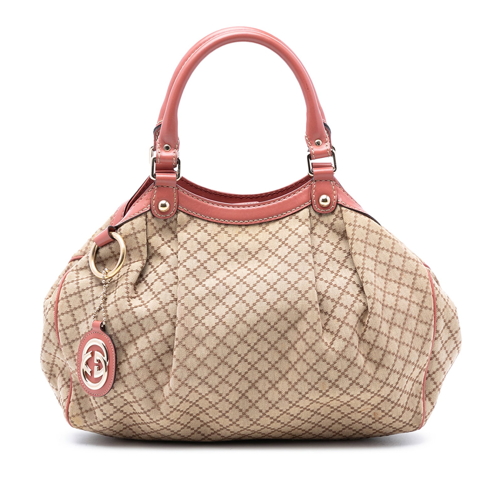 Gucci Sukey Tote Medium Beige Diamante Canvas with Leather Trim: Gucci Sukey Tote Medium Beige Diamante Canvas with Leather Trim This Gucci Medium Diamante Canvas Sukey Tote features a beige canvas body with leather trim and rolled leather handles. The bag has an o
