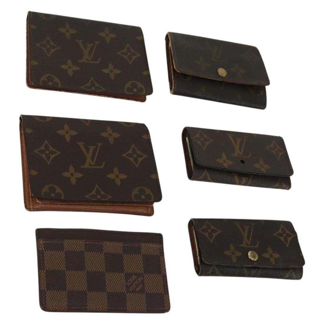 Louis Vuitton Monogram Canvas Six Hook Damier Ebene Key Holder: Louis Vuitton Monogram Canvas Six Hook Damier Ebene Key Holder This is a LOUIS VUITTON key case crafted from monogram canvas in the Damier Ebene pattern. The item shows significant signs of use, inclu