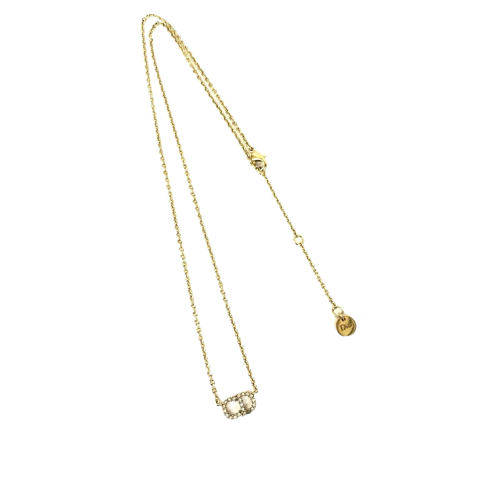 Clair D Lune Gold Plated Necklace with Crystal Pendant by Dior: Clair D Lune Gold Plated Necklace with Crystal Pendant by Dior This Dior Clair D Lune necklace features a gold plated metal body with a pendant adorned with rhinestone embellishments. It is secured by