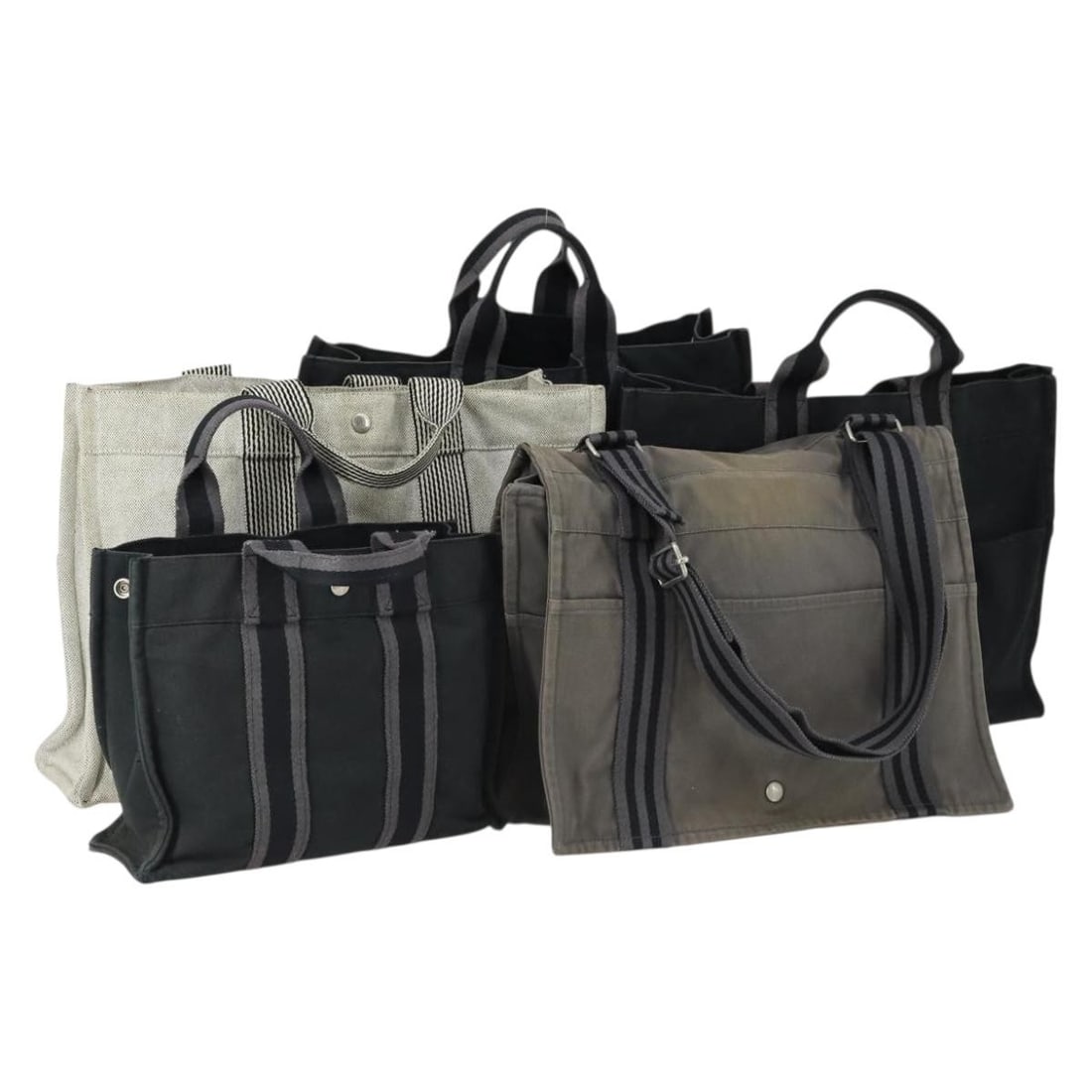Hermes Gray Black Canvas Handbag Set of 5: Hermes Gray Black Canvas Handbag Set of 5 This is an authentic HERMES Fourre Tout hand bag set, featuring five pieces crafted from gray and black cotton canvas. The bags are made in France and exhibit