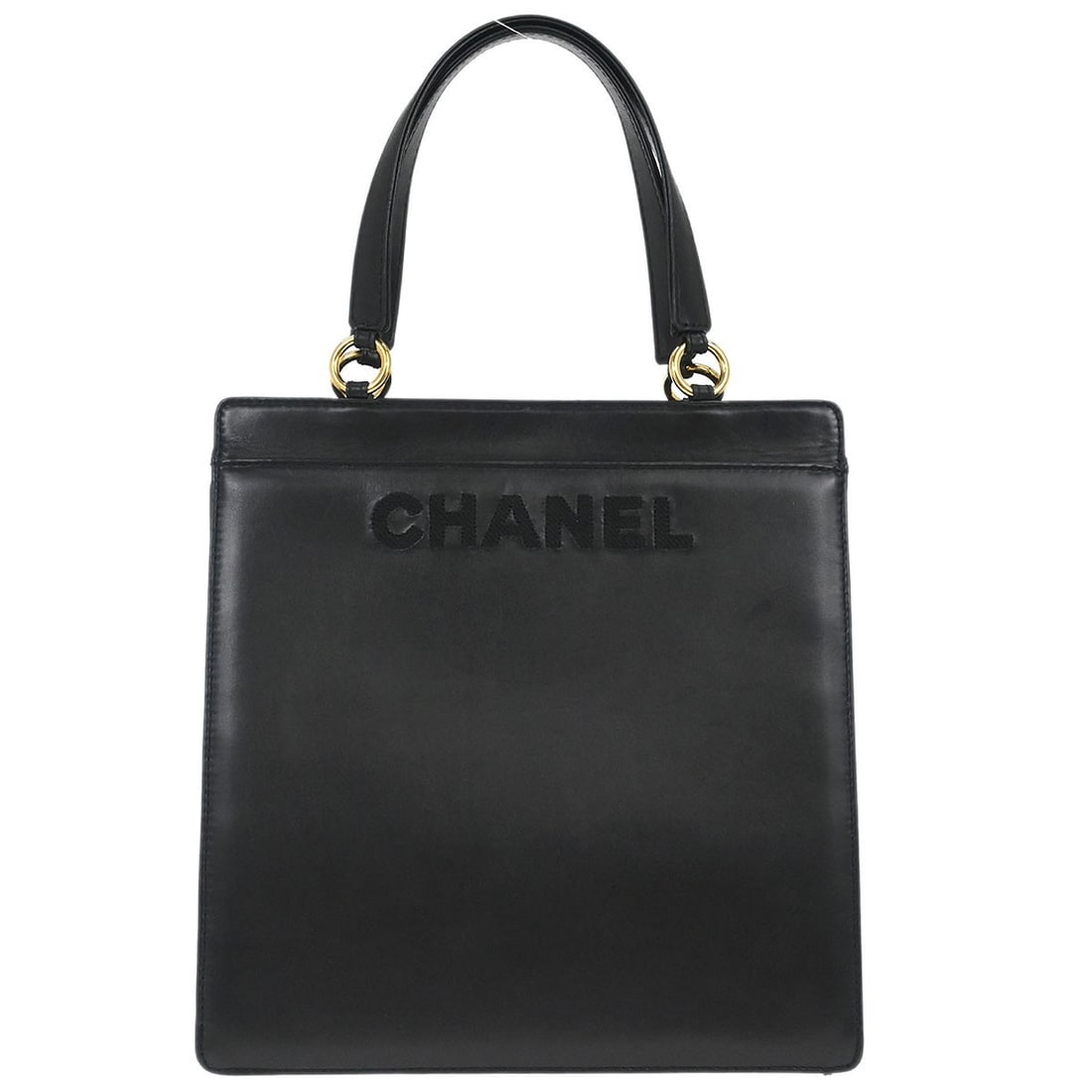 Medium Black Leather Double Handle Tote by Chanel: Medium Black Leather Double Handle Tote by Chanel This Chanel tote bag is crafted from black lambskin leather and features a medium size with double handles. The bag offers a handle drop of 6 inches a