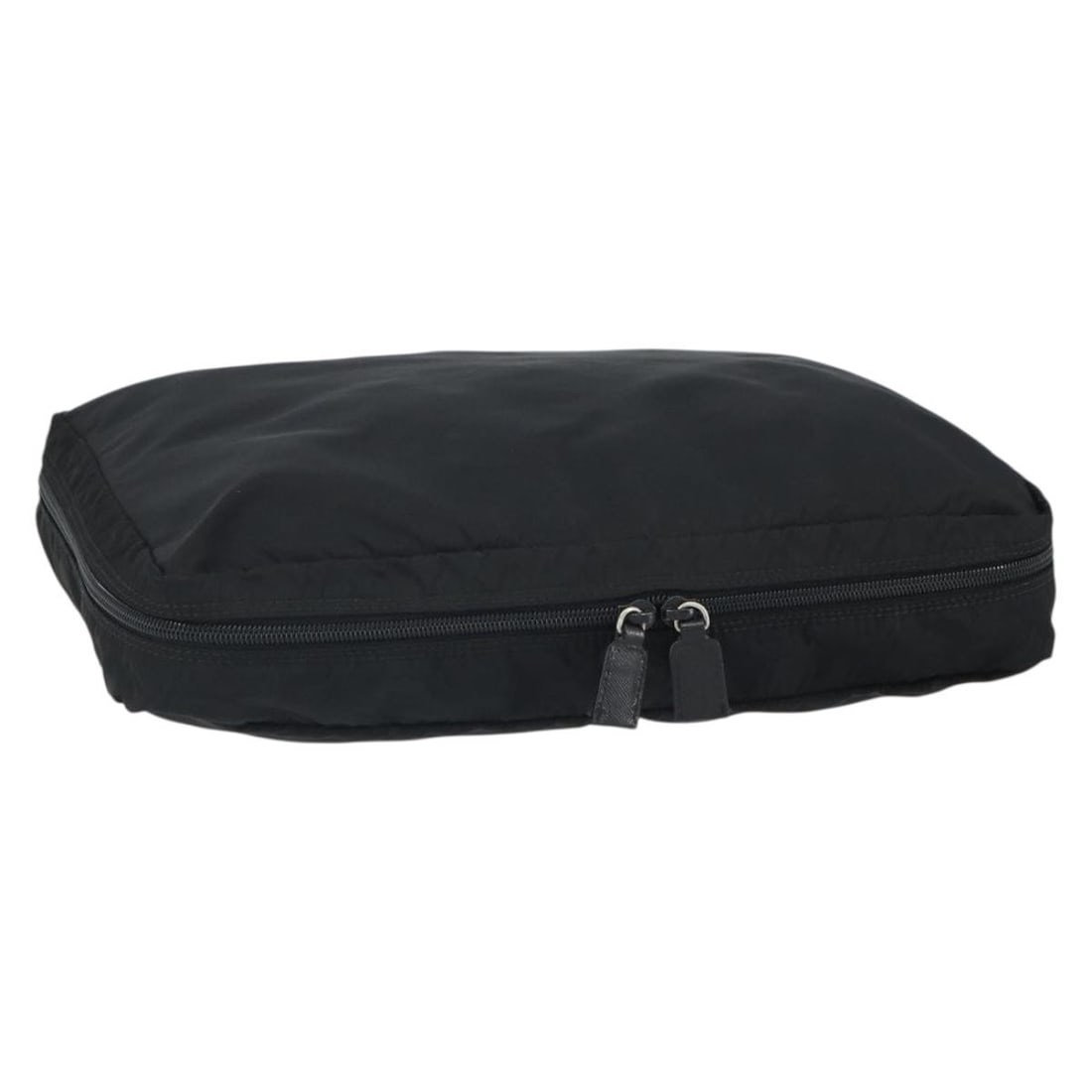 Black Silver Nylon Clutch by Prada Italy: Black Silver Nylon Clutch by Prada Italy This PRADA clutch bag is crafted from black nylon with silver-tone accents. Made in Italy, it features a compact design with approximate dimensions of 34 cm in
