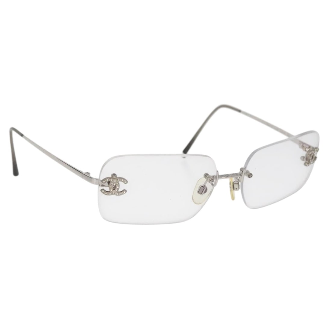 CHANEL 2047-B Silver Metal Prescription Glasses With Case: CHANEL 2047-B Silver Metal Prescription Glasses With Case These CHANEL COCO Mark 2047-B glasses feature a silver-tone metal frame and are designed for women. Made in Italy, they have a modern silhouet