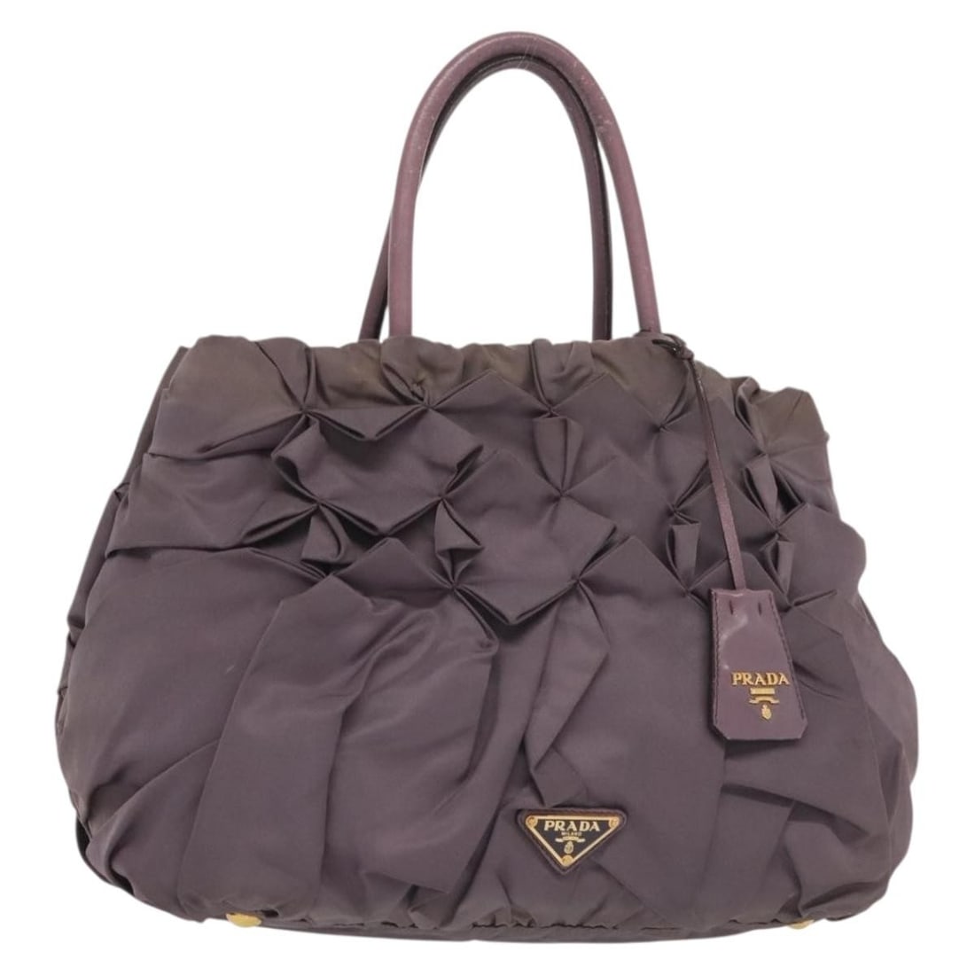Prada Nylon Purple Gold Handbag with Clochette Italy: Prada Nylon Purple Gold Handbag with Clochette Italy This PRADA handbag is crafted from durable nylon in a striking purple and gold color combination. Designed for women, the bag features a practical 