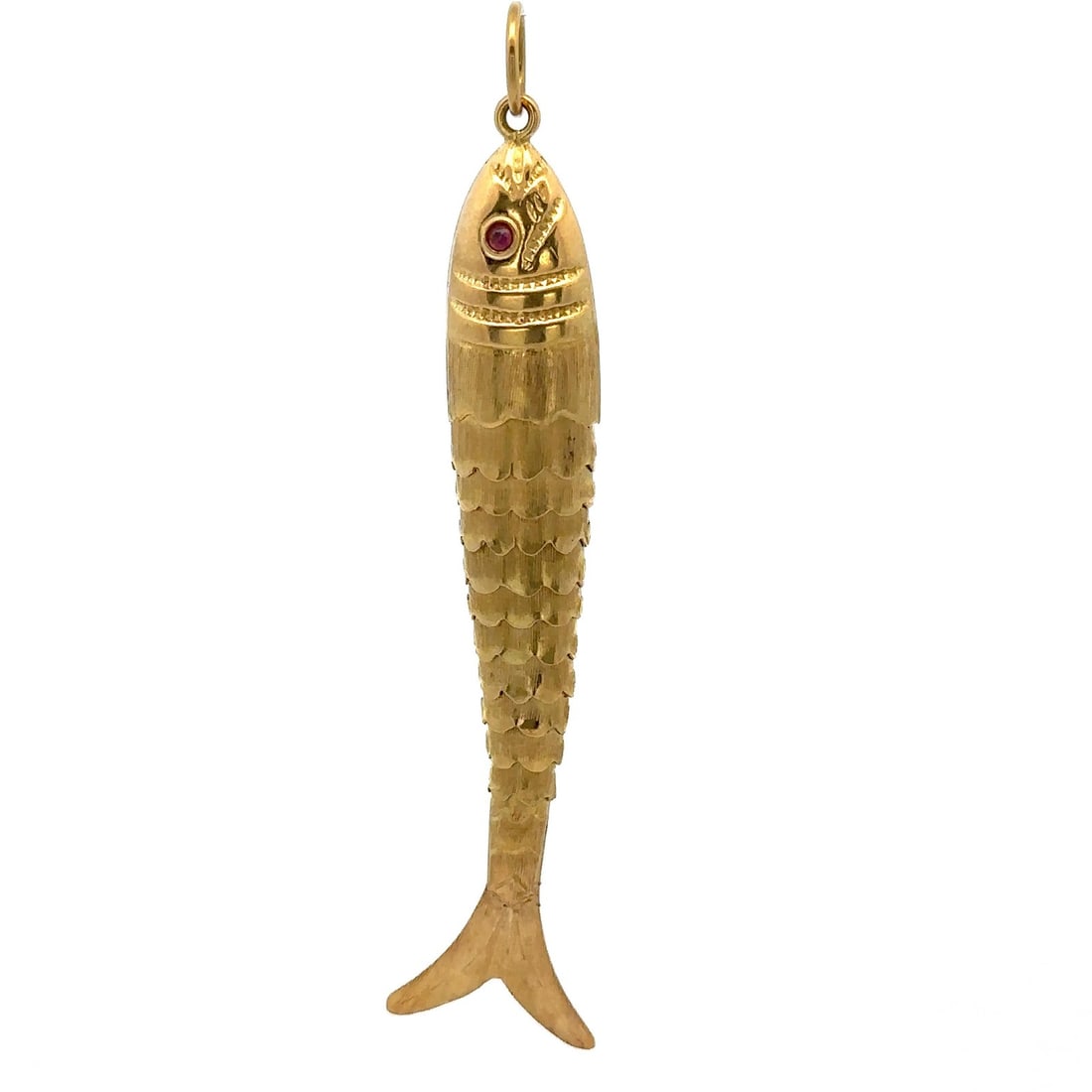 Articulated 18k Yellow Gold Fish Pendant With Red Stone Eyes Vintage: Articulated 18k Yellow Gold Fish Pendant With Red Stone Eyes Vintage This vintage pendant features a large, articulated fish crafted in solid 18k yellow gold. The flexible design is accented with two 