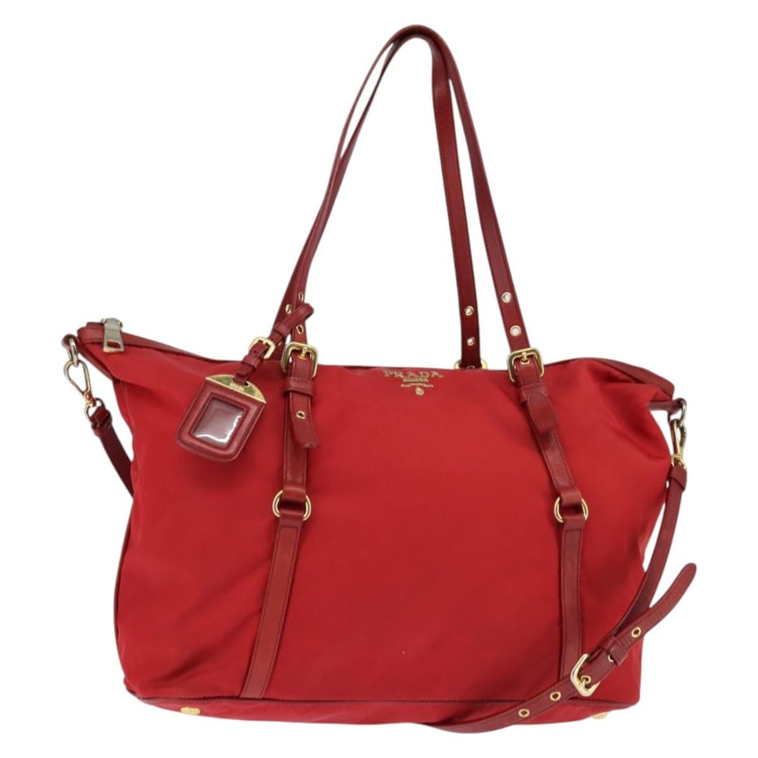 Prada Red Gold Nylon Tote with Shoulder Strap Italy: Prada Red Gold Nylon Tote with Shoulder Strap Italy This PRADA tote bag is crafted from durable red nylon with gold-tone accents and offers both hand-carry and shoulder-carry options with its dual han