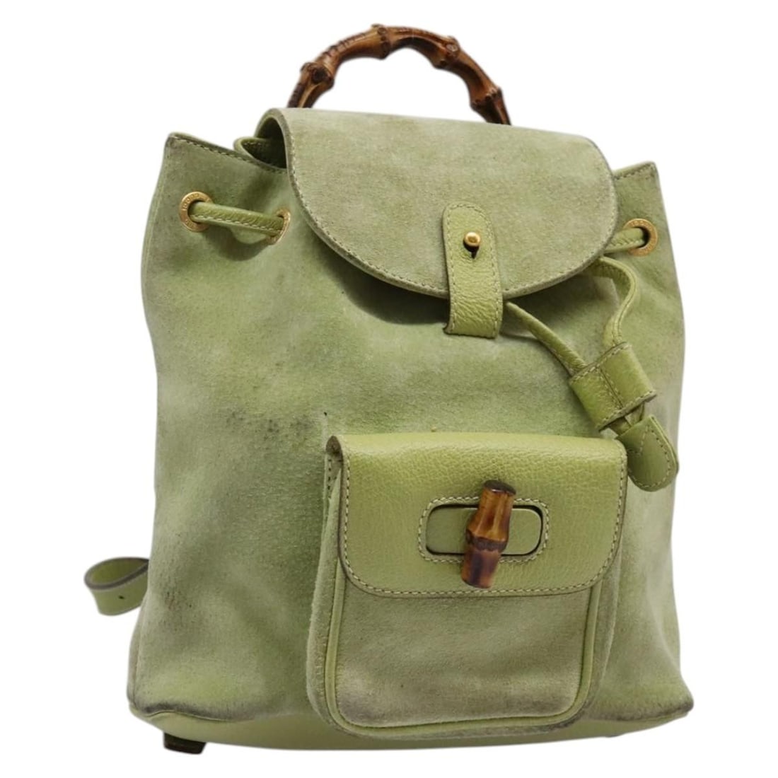 Green Suede Bamboo Backpack by Gucci Model 003 1956 0030: Green Suede Bamboo Backpack by Gucci Model 003 1956 0030 This GUCCI Bamboo Backpack features green suede leather with gold-tone accents. Designed for women, the backpack offers a compact and stylish p