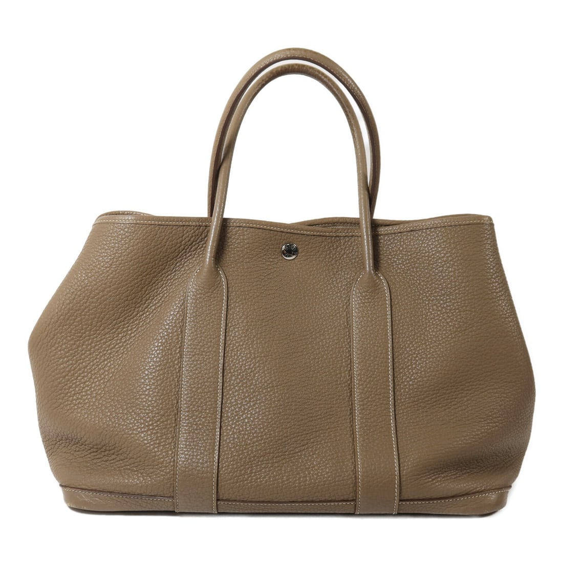 Hermes Garden Party PM Etoupe Calfskin Tote Bag: Hermes Garden Party PM Etoupe Calfskin Tote Bag This HERMES GardenParty PM tote bag is crafted from high-quality Negonda calfskin leather in an elegant gray tone. Designed for women, it features a spa