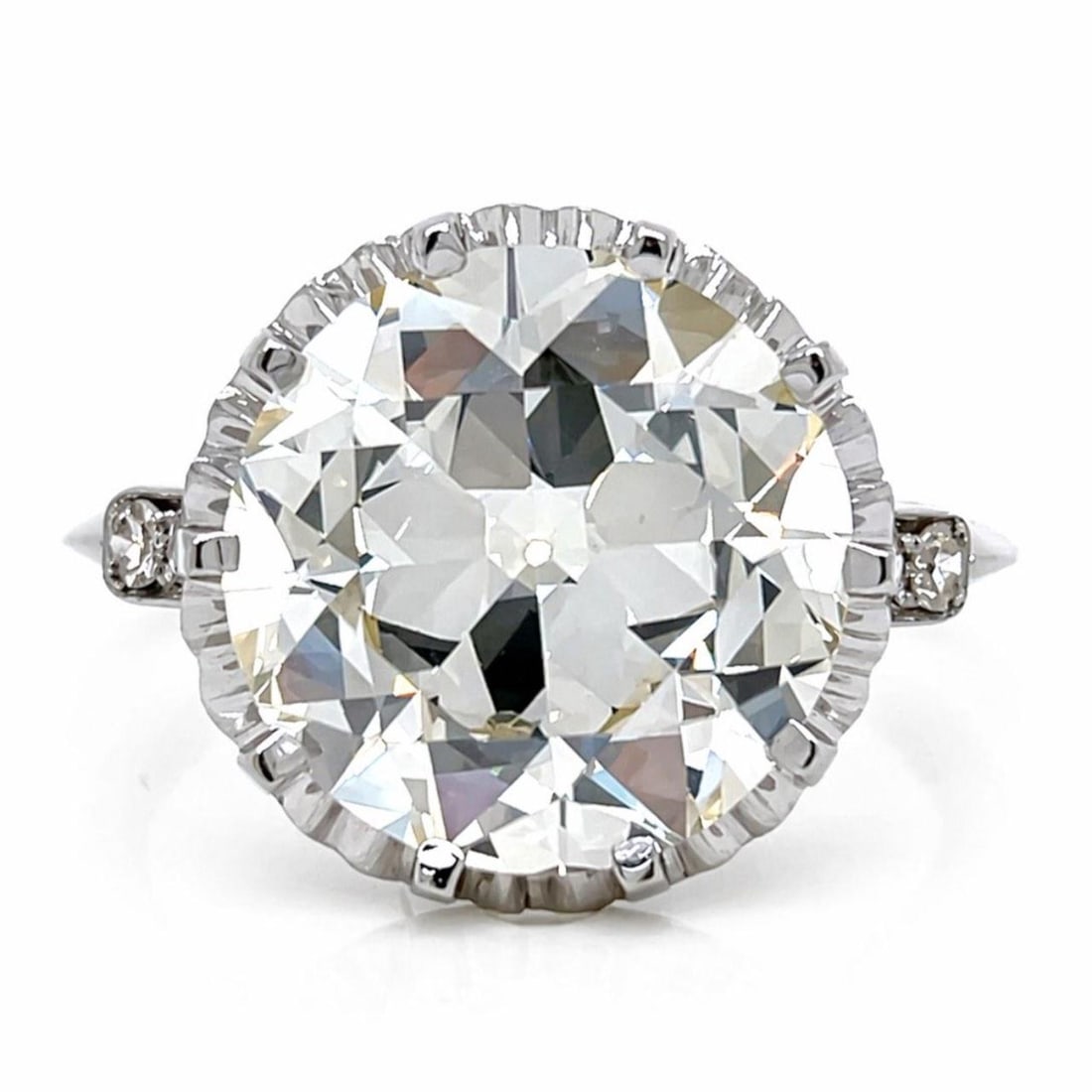 Platinum Art Deco Diamond Ring with 5.53 Carat GIA Stone: Platinum Art Deco Diamond Ring with 5.53 Carat GIA Stone This Art Deco platinum ring features a GIA certified 5.53 carat European-cut diamond with Q-R color and VS1 clarity. The center diamond is acco